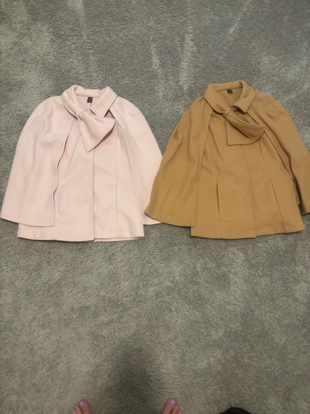2 Women’s Bow-Accent Cape. One Light Pink, One Camel.
